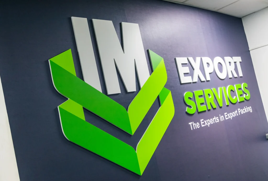 IM Export Services internal office signage displaying company logo and branding