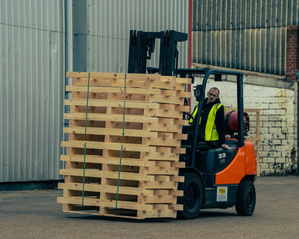 Pallets being loaded onto lorry.